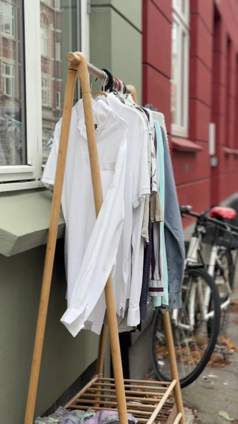 Clothes Hanging on a Rack Outdoors Stock Footage 340478854
