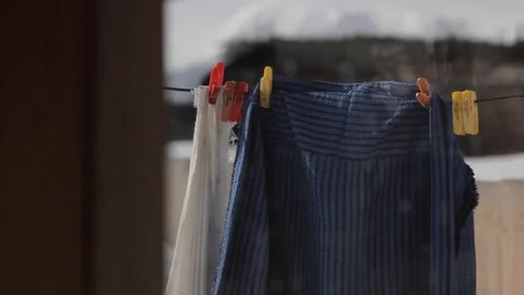 Clothes hanging on a rope and drying Stock Footage 87239949