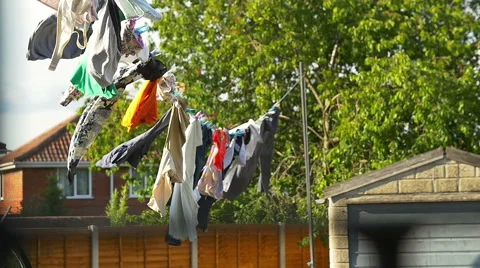 Clothes hanging in the sun Video stock 53747576