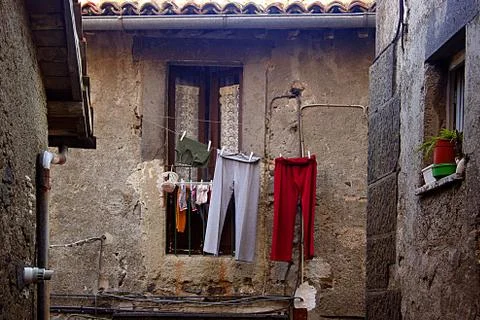 Clothes hanging in the window Foto stock