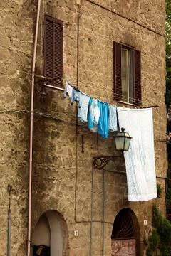 Clothes hanging at the window Фото