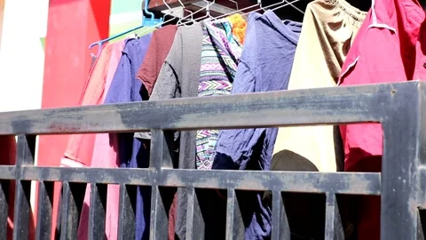 Clothes that have just been washed and dried outside the house in the sun Stock-Footage 182209618