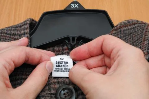 Clothes label. 3X. 3 extra grande. Made in China. Stock Photos