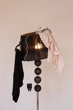 Clothes on the lamp, wardrobe Stock Photos