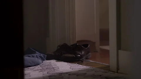 Clothes left behind on the floor of a house that starts to fill with smoke Stock-Footage 134300576