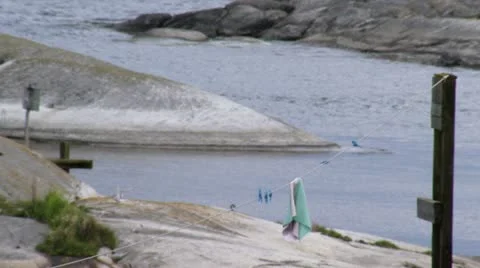 Clothes line in an archipelago setting Stock Footage 11340070