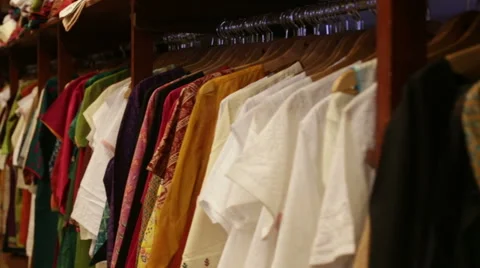 Clothes lying on the shelves in the store Video stock 41628095