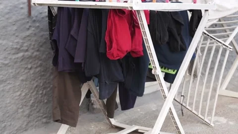 Clothes moving and drying in the wind Stock Footage