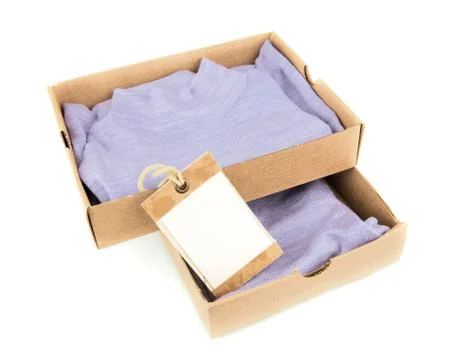Clothes in open containers with card Stock Photos
