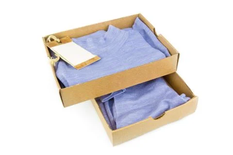Clothes in open containers with card Stock Photos