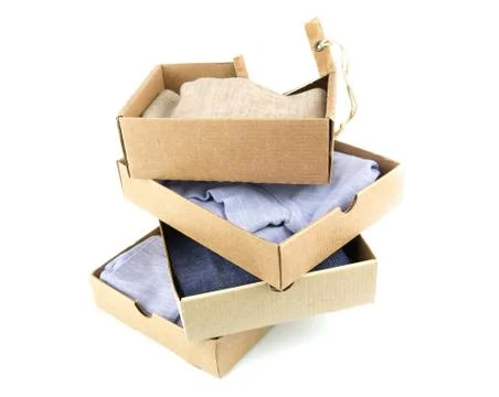 Clothes in open containers with card Stock Photos