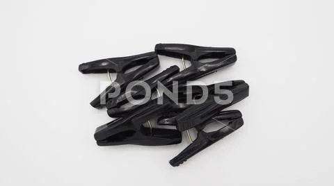 Clothes peg black color on white background,plastic made Stock Photos