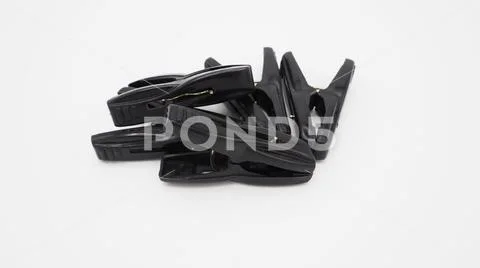 Clothes peg black color on white background,plastic made Stock Photos