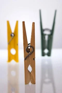 Clothes pegs with reflection. Illustrazione stock