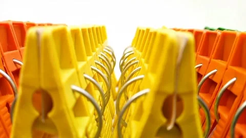 Clothes pegs sets moving, sets of multi color plastic clothes pins or laundry Video stock 304688515
