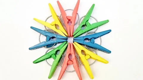Clothes pins, multi color plastic laundry clips or clothes pegs in a circle Stock Footage 305894510