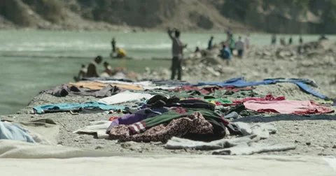 Clothes put to dry on Ganges riverbed Stock Footage 59978896
