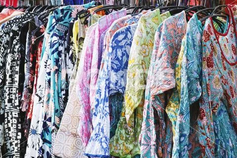 Clothes rack with boho hippie style floral pattern women's fashion Stock Photos