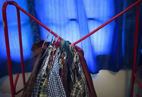 The clothes rack is broken due to unable to support the weight of clothes Stock Photos