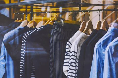 Clothes on a rack in a store Stock Photos