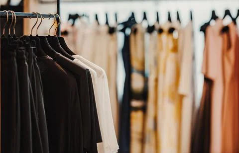 Clothes on a rack in a store Stock Photos