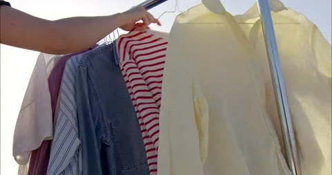 Clothes on rail outdoor Stock Footage 221706214