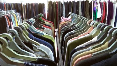 Clothes in a second-hand store. 스톡 사진