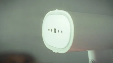 The clothes sender is operation emitting hot steam from its heating element Stock Footage 331363486