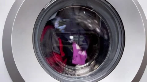 Clothes Spinning Inside Front Loading Washing Machine Door View Stock Footage 330359012
