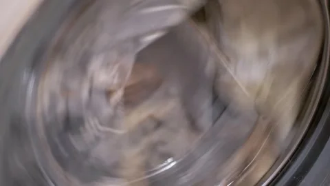 Clothes Spinning Rapidly In A Washing Machine During Spin Cycle Stock-Footage 332664814