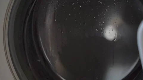 Clothes Spinning in a Washing Machine Drum During a Wash Cycle Video stock 341389441