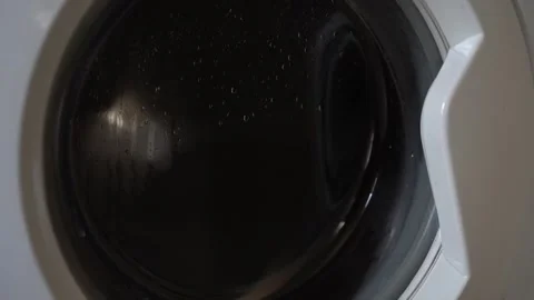 Clothes Spinning in a Washing Machine Drum During a Wash Cycle Video stock 341389553