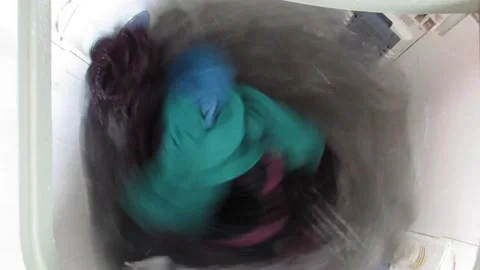 Clothes spinning in the washing machine. Laundry concept video. Stock Footage 133545432
