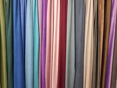 Clothes stack. Bright colourful fabric Stock Photos