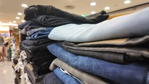 Clothes stacked inside a store in early morning hours Stock Footage 335800645
