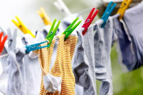Clothes streched with multicolor clamps Stock Photos