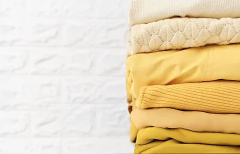 Clothes in trendy colors of the 2021 in stack. 스톡 사진