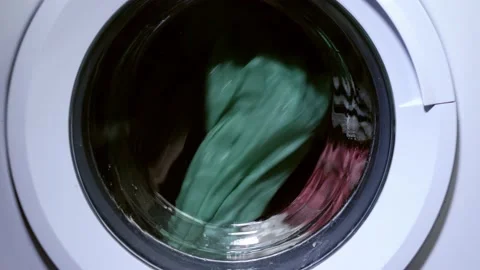 Clothes turn in the washing machine medium shot 스톡 동영상 200155539