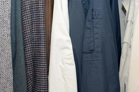 Clothes in wardrobe Stockfoto's