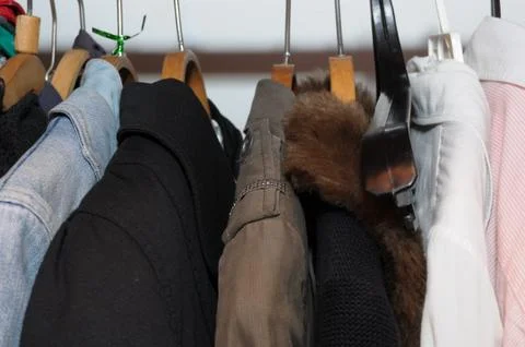 Clothes in the wardrobe Stock Photos