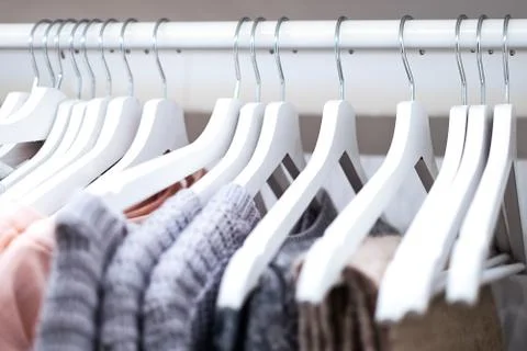 Clothes in wardrobe Stock Photos