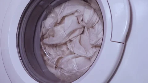 Clothes in washing machine. Laundry concept. Stock Footage 233022053
