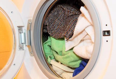 Clothes in washing machine. Stock Photos