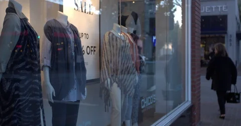 Clothes at window display during dusk Stock-Footage 84515790