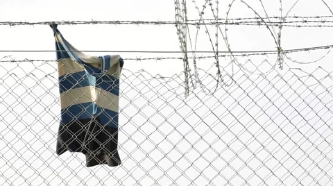 Clothes on Wire Fence Stock Footage 64847295