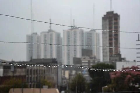 Clothesline cable full of small drops on a rainy day with a selective focus Stock Photos