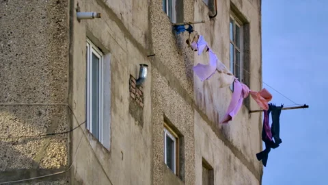 Clothesline drying clean clothes on building Clothesline drying natural Stock Footage 264328758