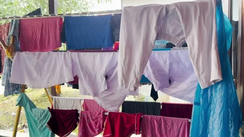 Clothesline in front of the house Stock Footage 211395303