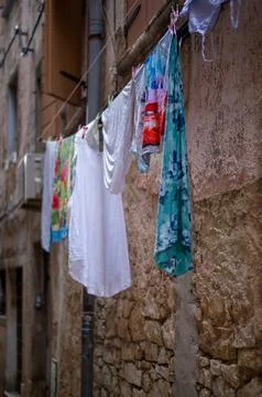 Clothesline in the old town Stock Photos