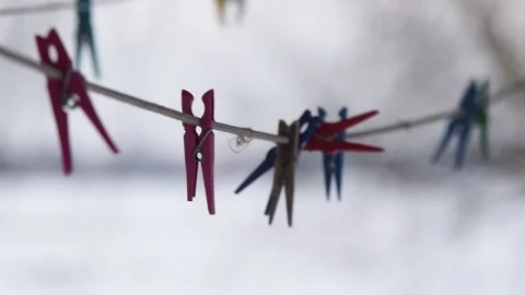 The clothesline with pegs flutter in the wind Stock Footage 147856224